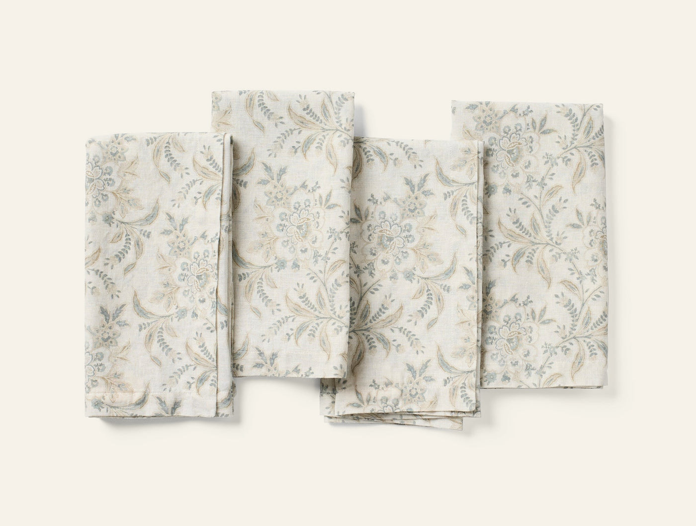 Coyuchi Marguerite Print napkin set of four, ivory linen with soft sage floral print.