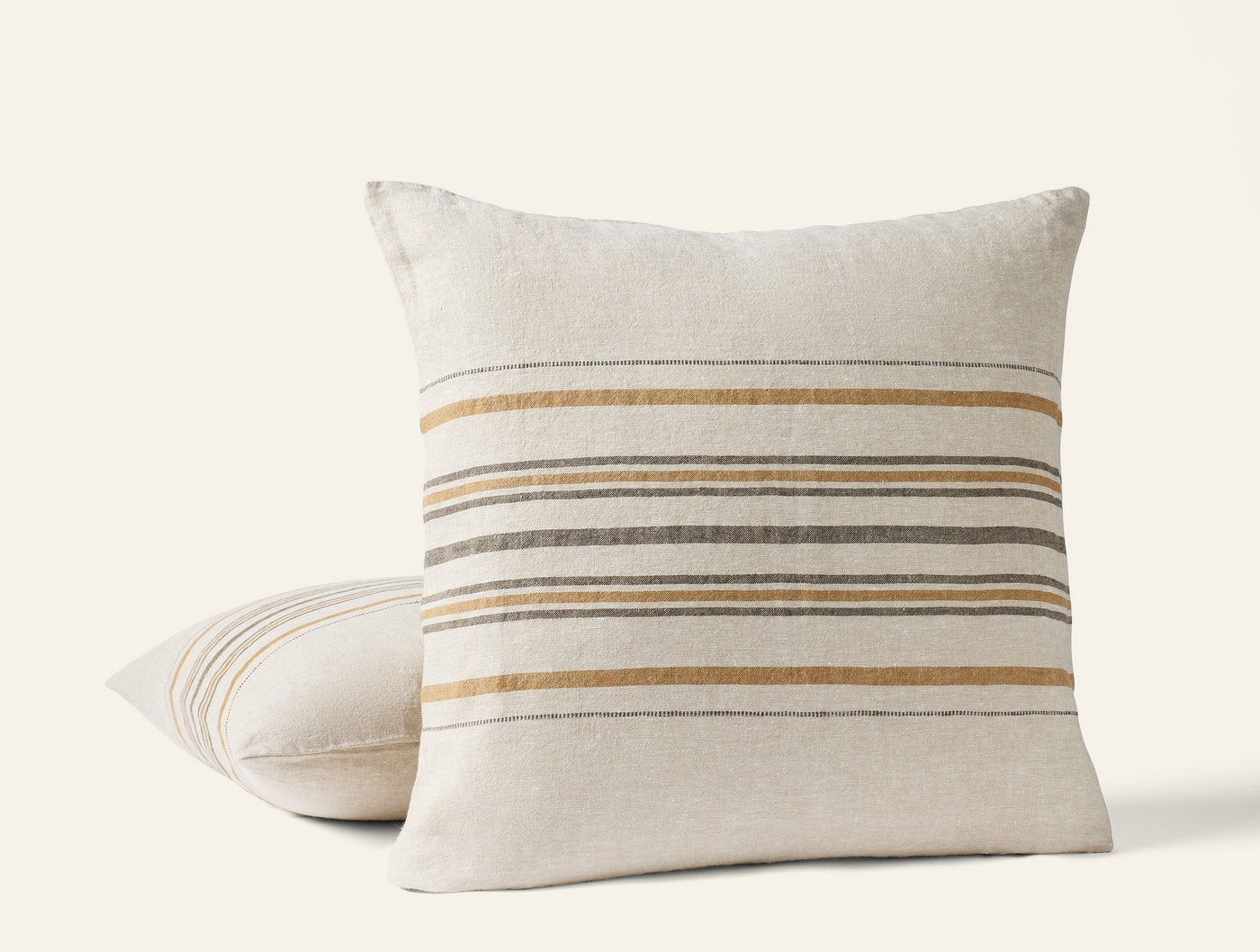 Coyuchi Mojave Linen decorative pillow in ivory with ochre and slate horizontal stripes.