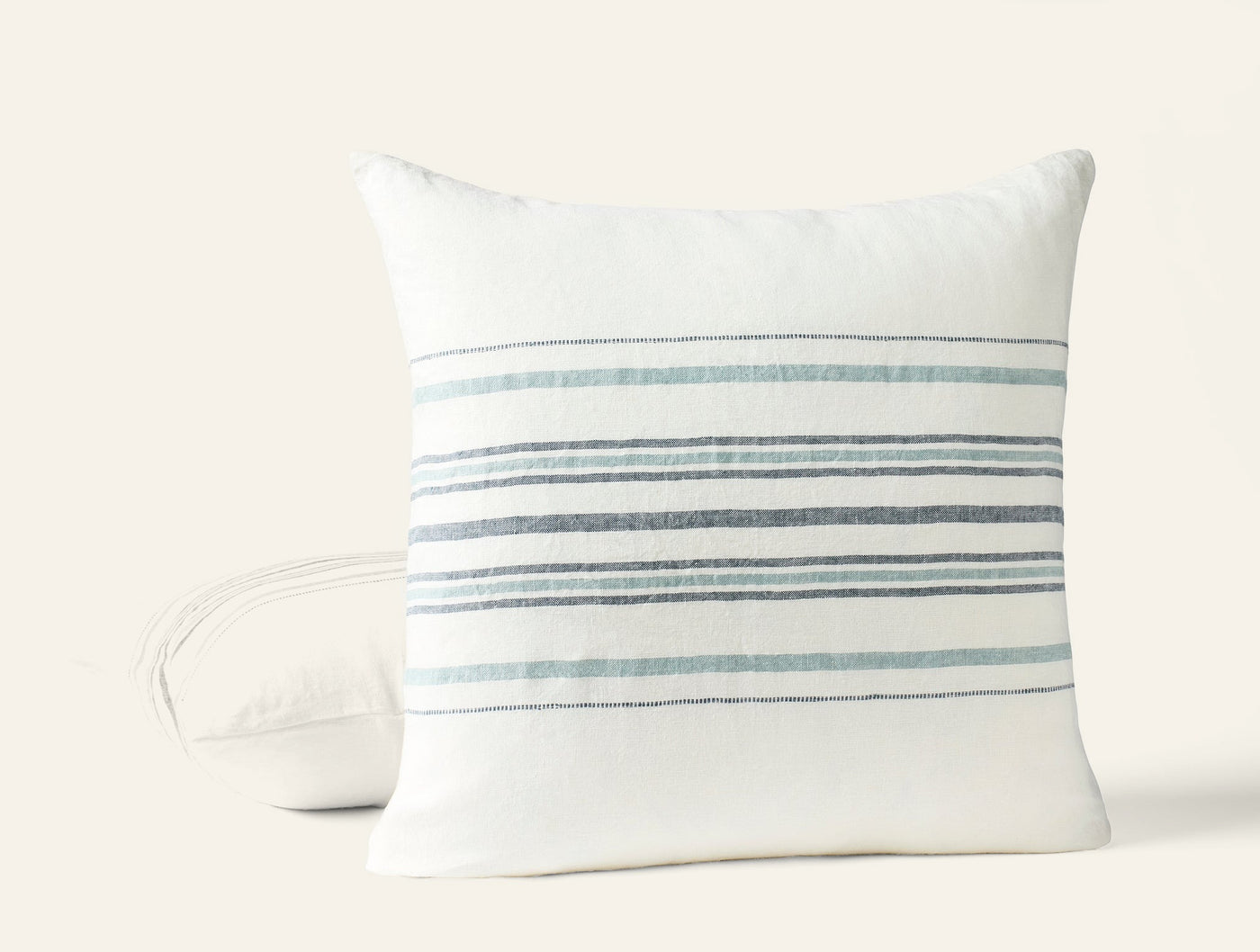 Coyuchi Mojave Linen pillow back and front view, ivory with blue-grey stripes.