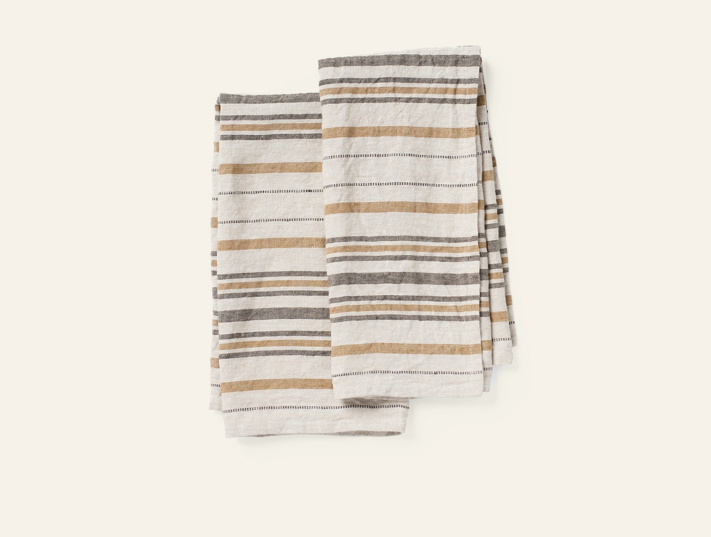 Coyuchi Mojave Linen hand towel pair, ivory with gold and gray stripes, folded.