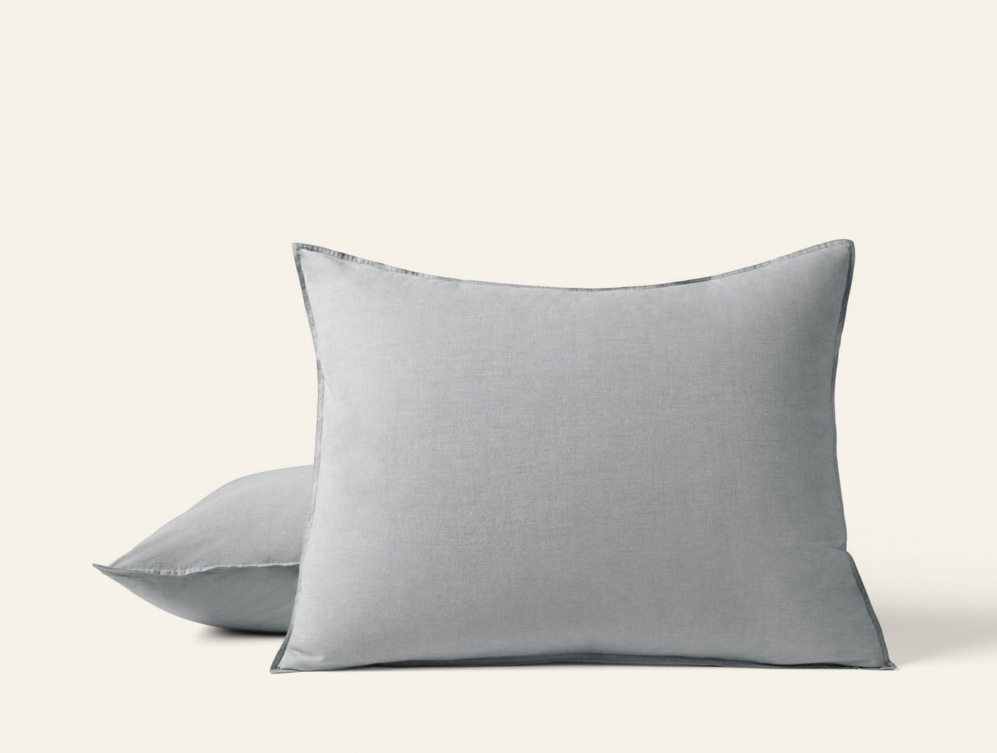 Two Coyuchi Crinkled Percale shams in mist gray, stacked against white background.