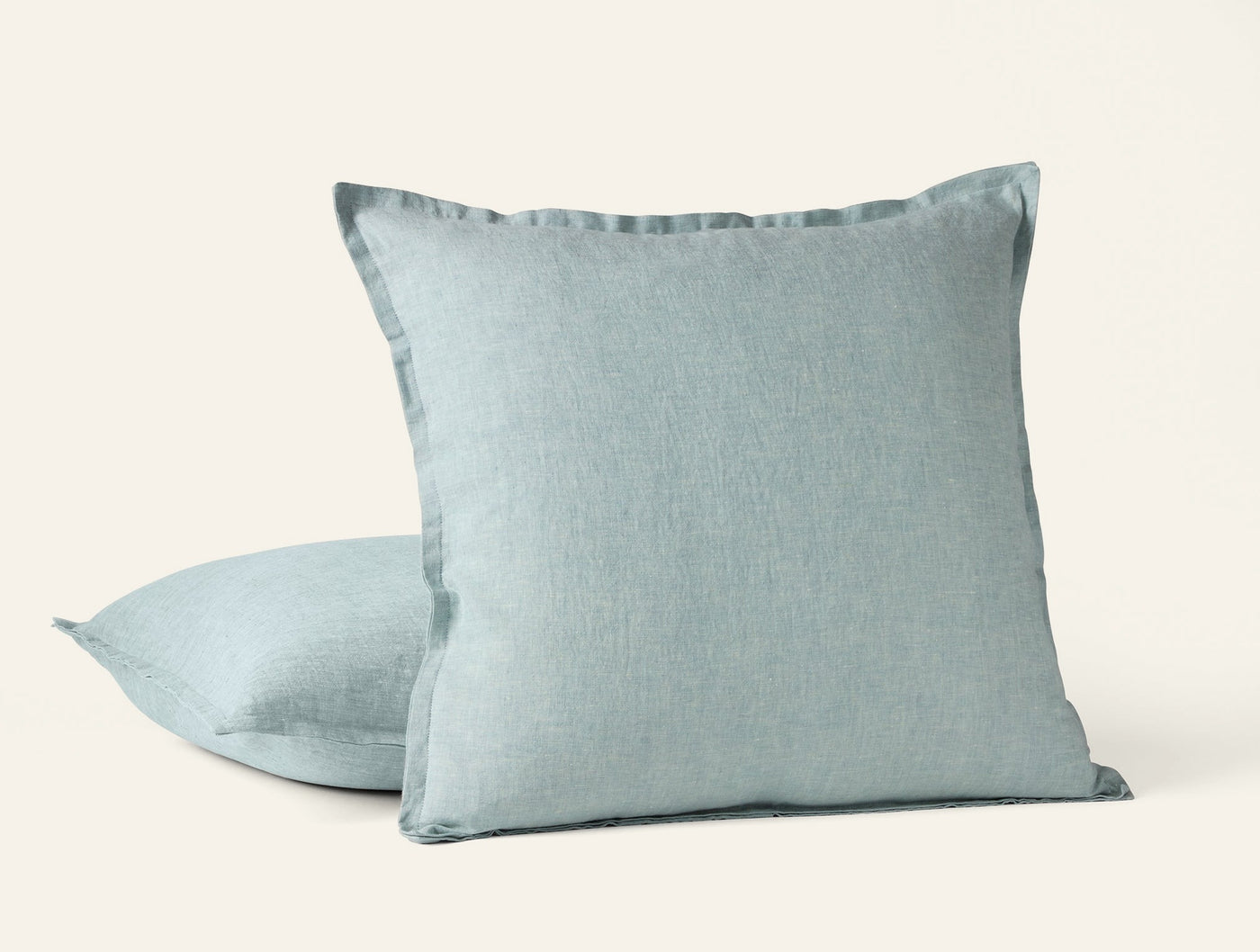 Pair of Coyuchi Relaxed Linen decorative pillows in mist blue with flange edge detail.