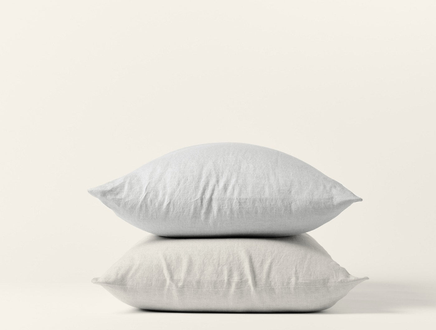 Two stacked Coyuchi Relaxed Linen pillowcases in white, showcasing soft, relaxed drape.