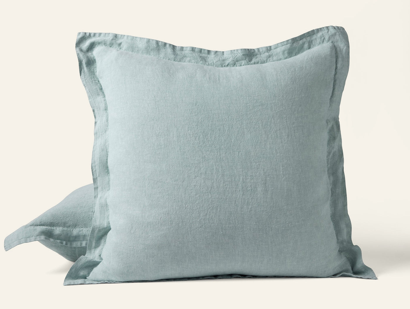 Coyuchi Relaxed Linen sham in seafoam, showing flange edge detail and softly rumpled texture.