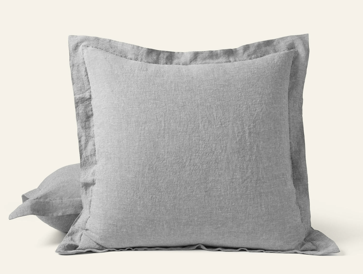 Coyuchi Relaxed Linen sham in silver-gray, flanged edge detail, square Euro size.
