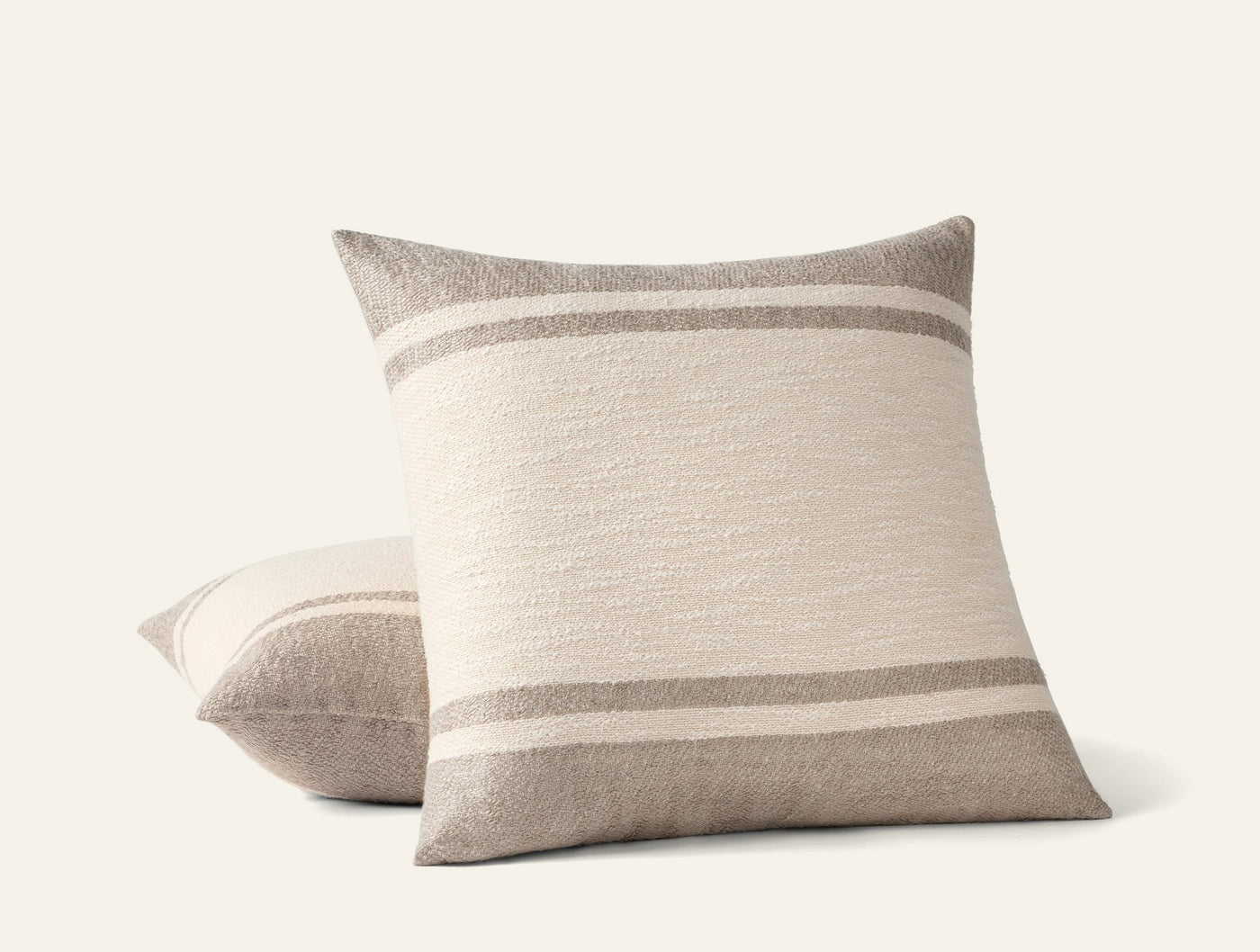 Coyuchi Pampas decorative pillow in ivory with taupe side panels and double stripe detail.