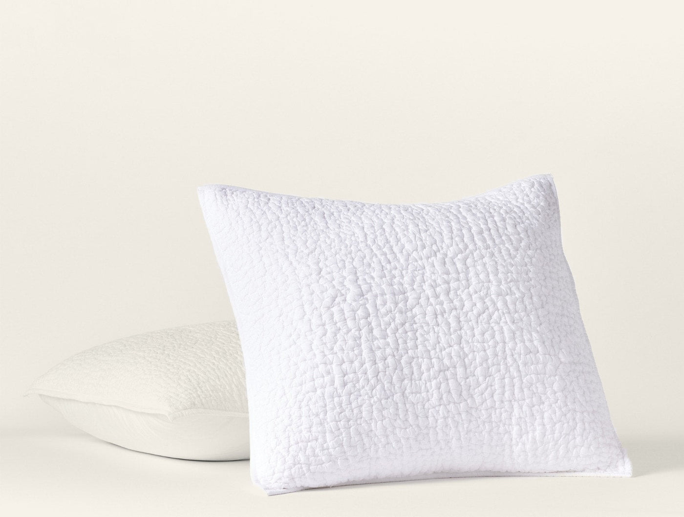 Coyuchi Pebbled Handstitched pillow sham in white with textured quilted surface.