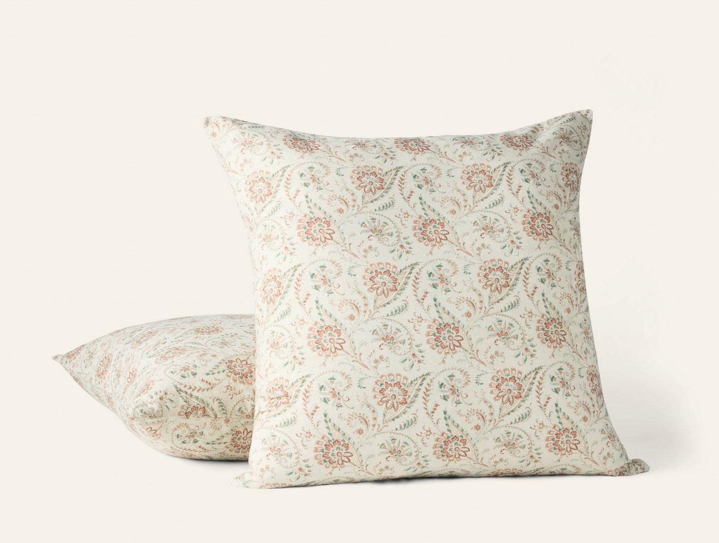 Coyuchi Ponderosa Print pillow covers in ivory with terracotta and sage floral block print pattern.