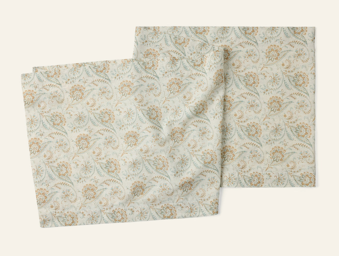 Coyuchi Ponderosa Print table runner, ivory with sage and ochre floral paisley pattern, set of two.