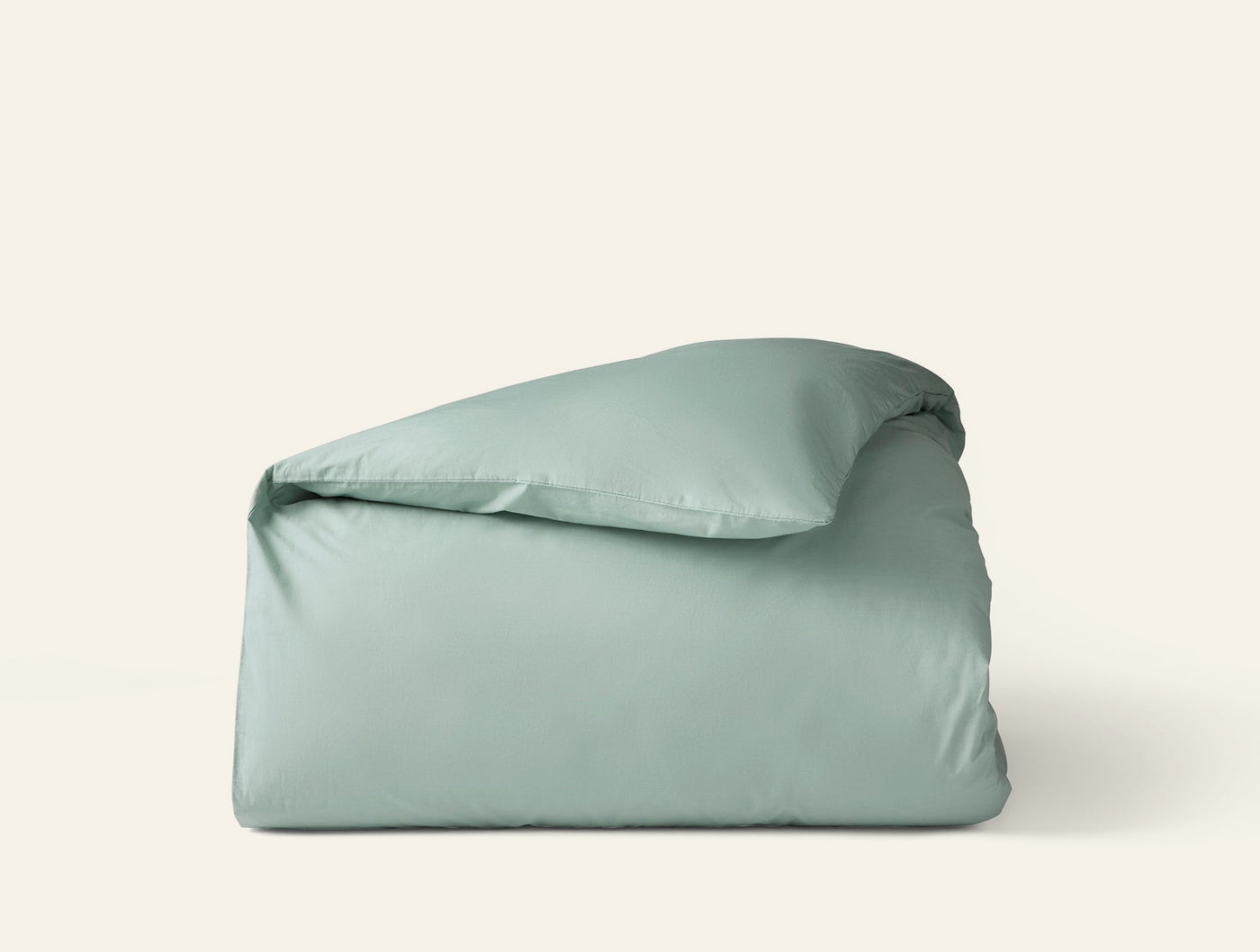 Coyuchi Refined Percale duvet cover folded, sage green percale cotton.