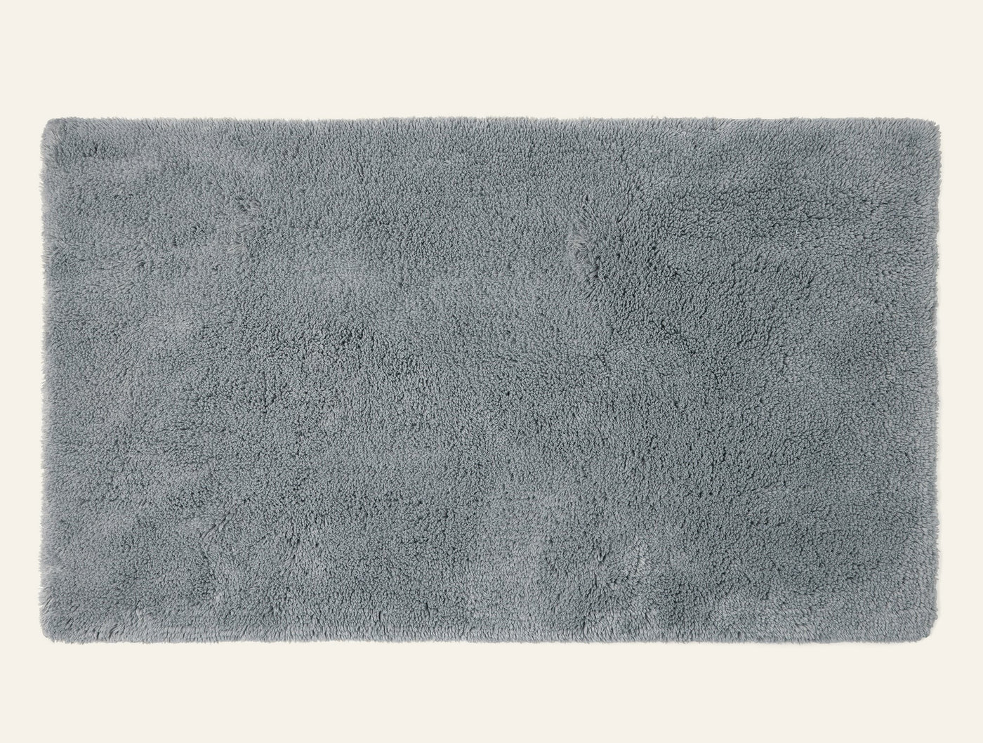 Coyuchi Shag bath rug in slate, overhead view showing plush looped pile texture.