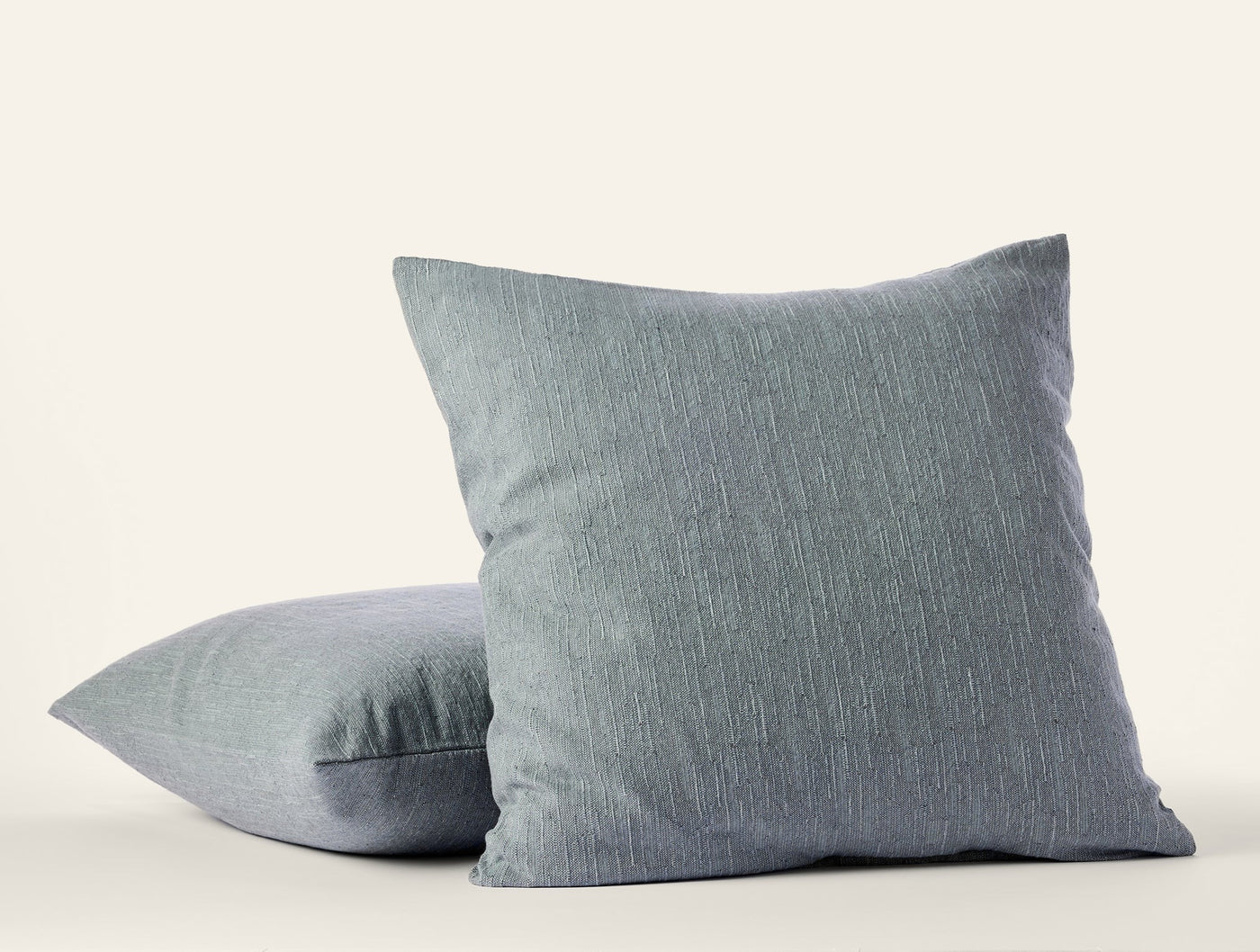 Two slate blue Coyuchi Toro Canyon shams stacked, showing subtle linen texture.