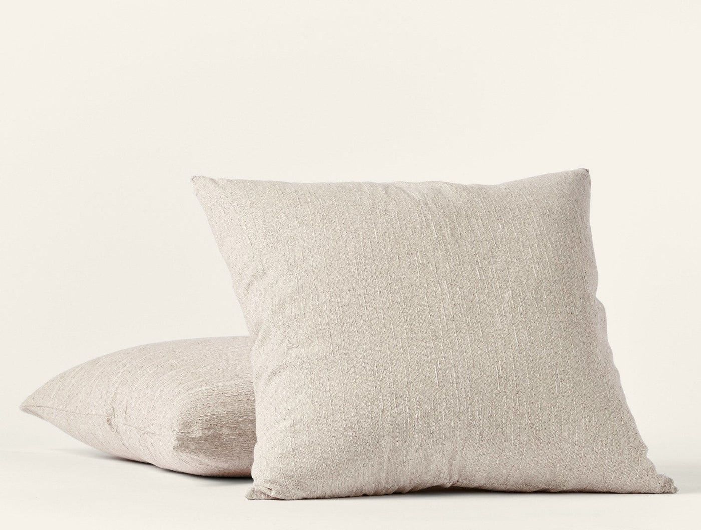 Two natural linen Coyuchi Toro Canyon shams stacked, showing subtle woven texture.