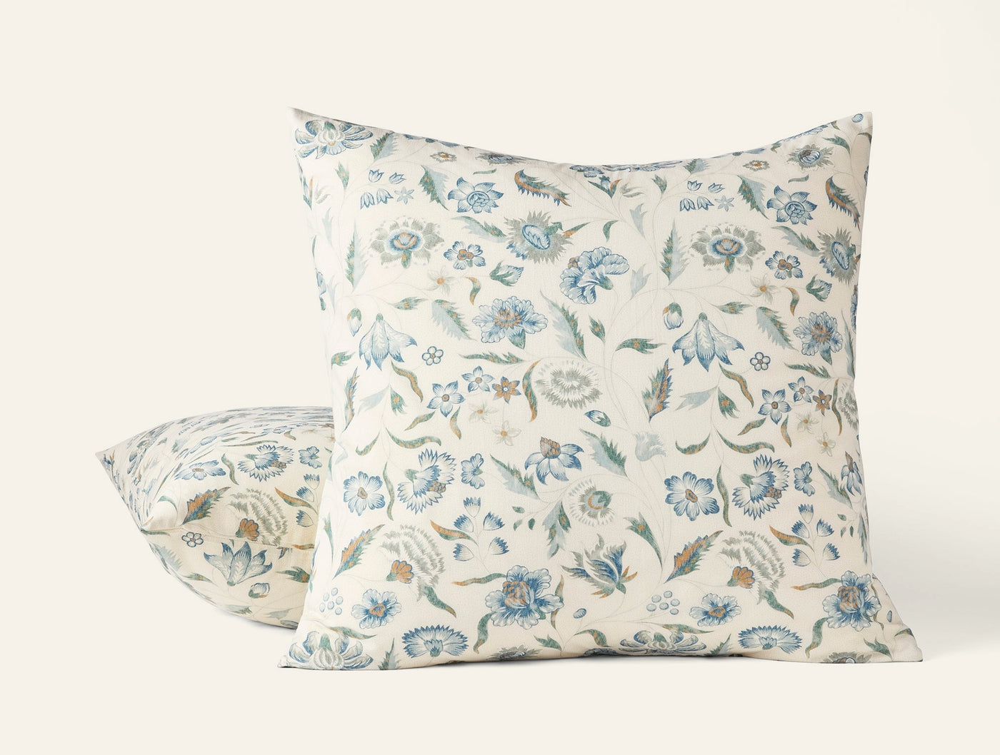 Coyuchi Viola Print pillow sham, ivory linen with blue and green floral print, two sizes shown.