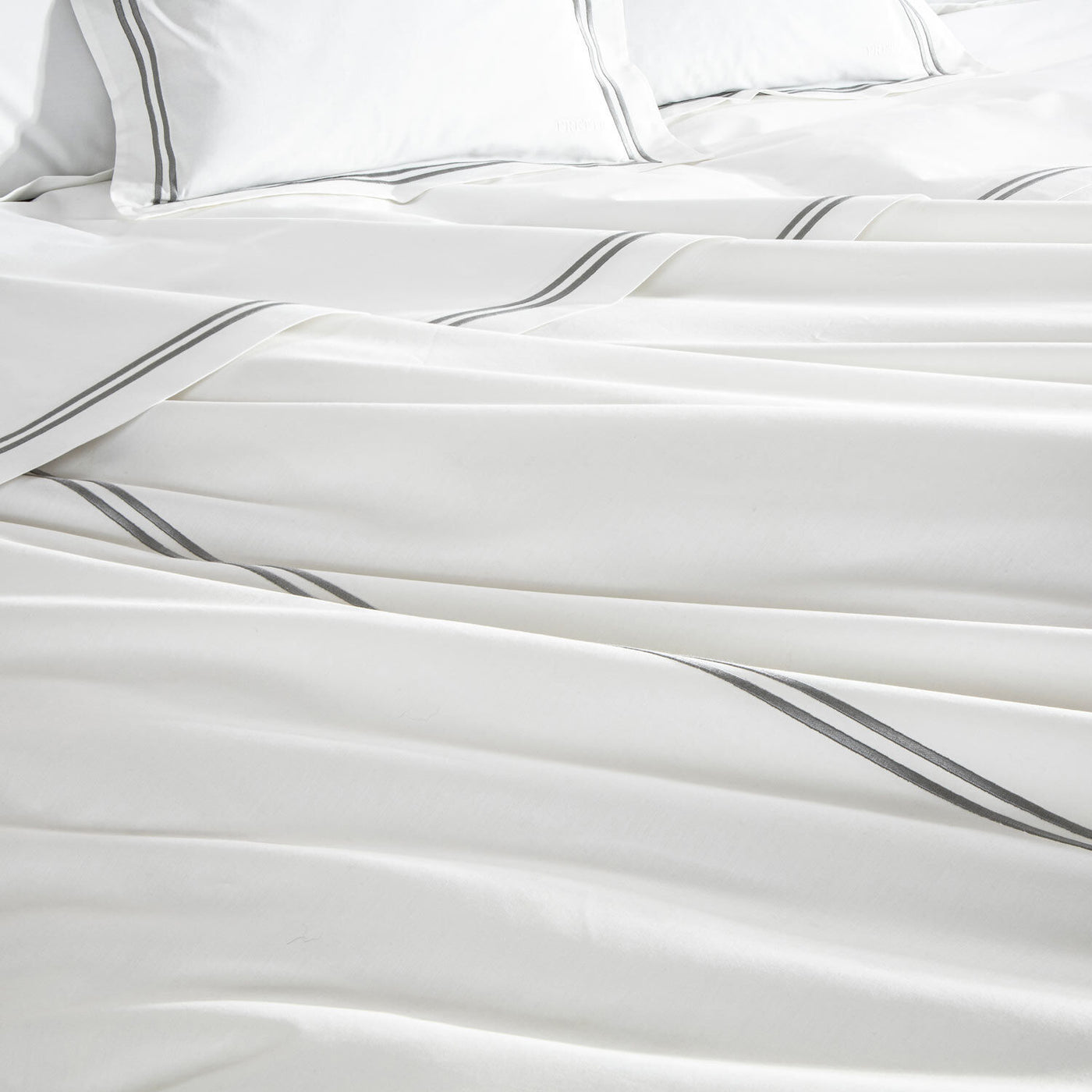 The Frette Classic | Duvet Cover by Frette features white cotton percale with gray stripes, offering a crisp feel and refined style—an elegant addition to the Classic Collection.