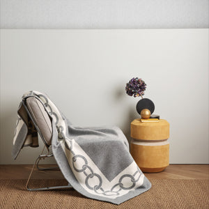 Photo of the The Chains Throw Blanket ensemble.