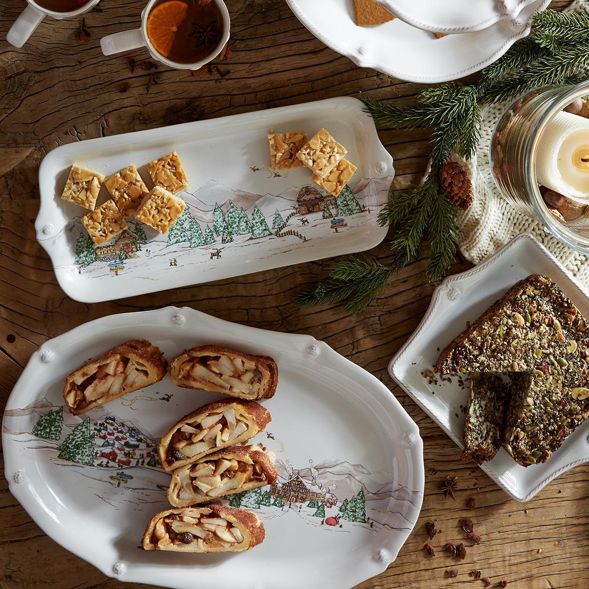 North Pole platter of sliced stollen beside a hostess tray of shortbread