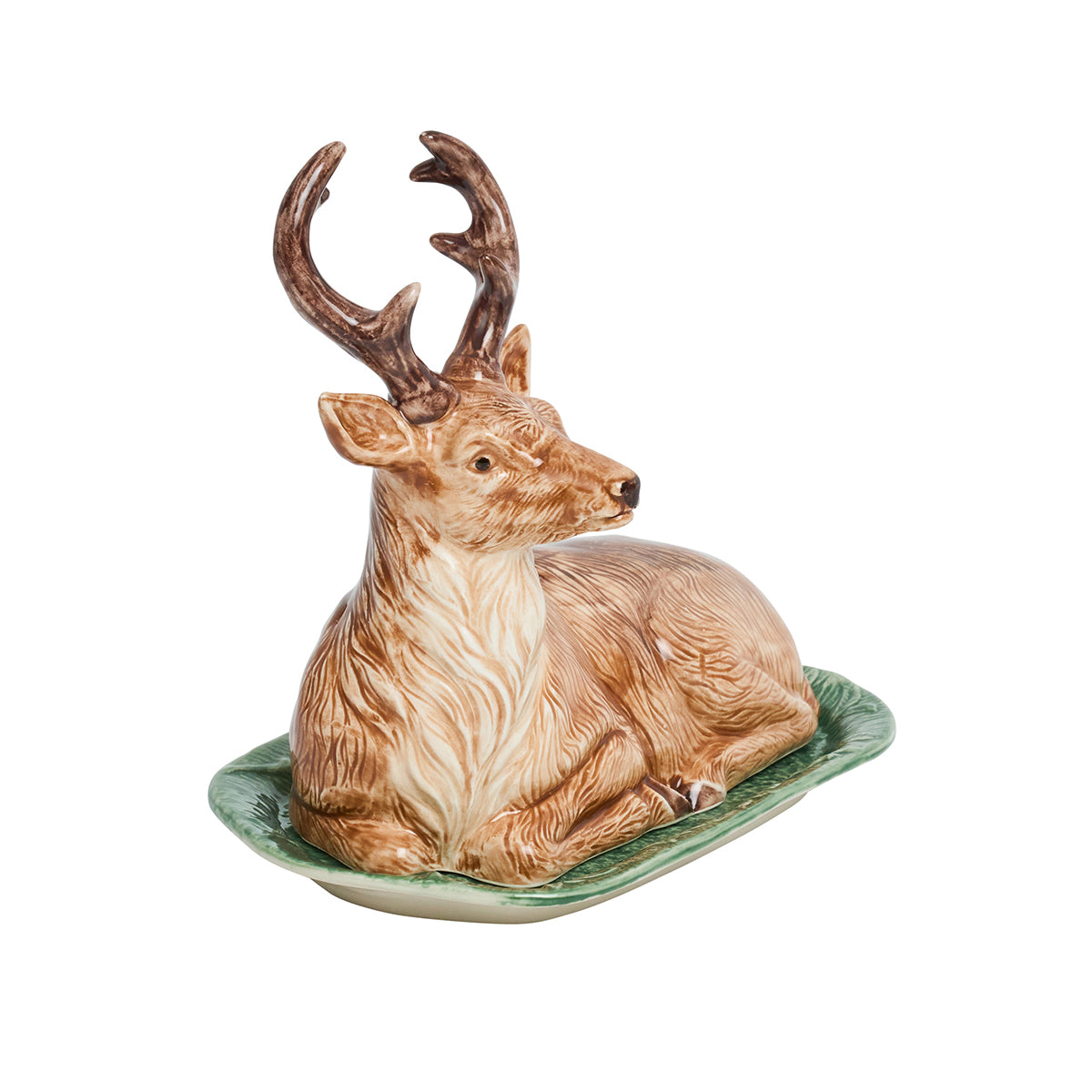 Juliska Forest Walk stag butter dish viewed from the side, reclining stag lid on a green base