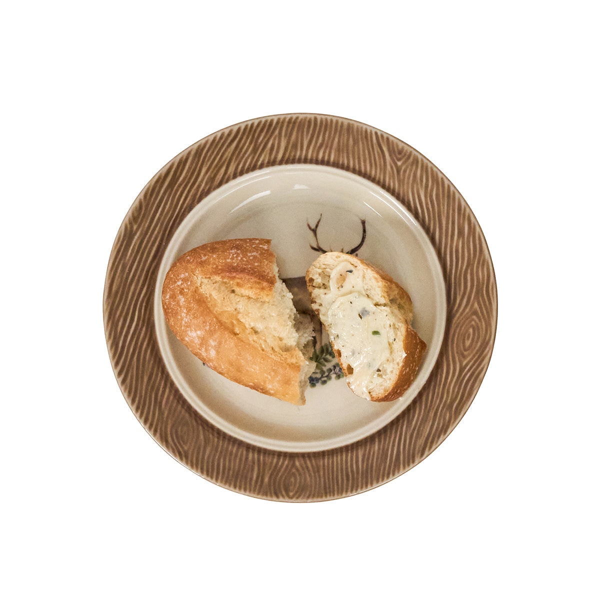 Juliska Forest Walk stag cocktail plate holding bread, with a brown woodgrain rim