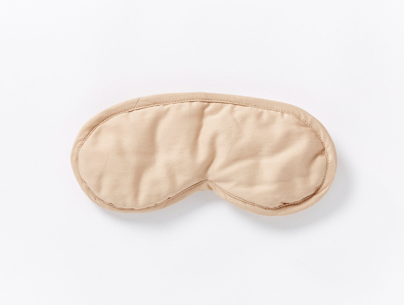Coyuchi Cloud Soft Sateen eye mask in sand, flat lay showing piped trim detail.
