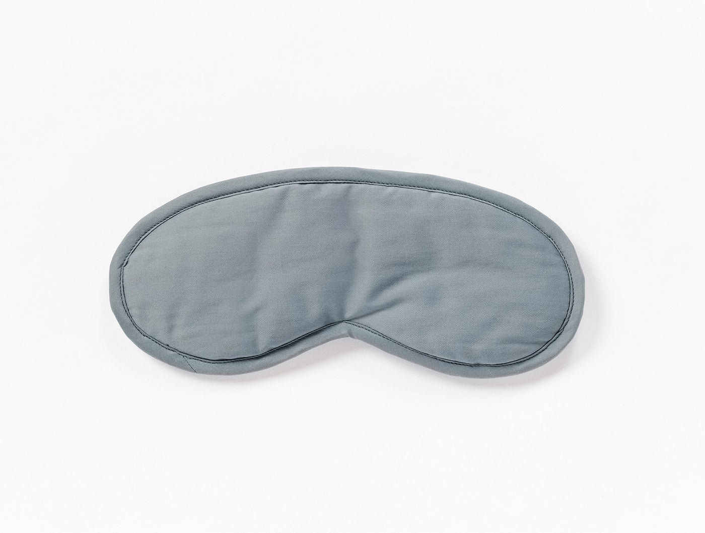 Coyuchi Cloud Soft Sateen eye mask in slate blue, displayed flat on white background.