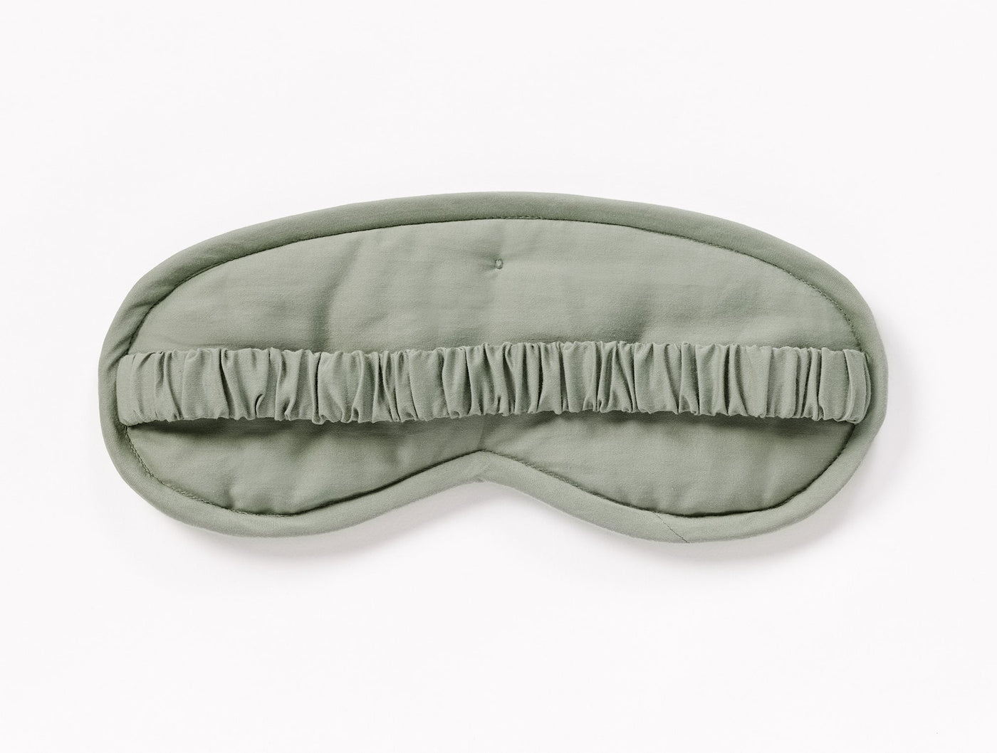 Coyuchi Cloud Soft Sateen eye mask in sage with gathered ruffle detail across center.