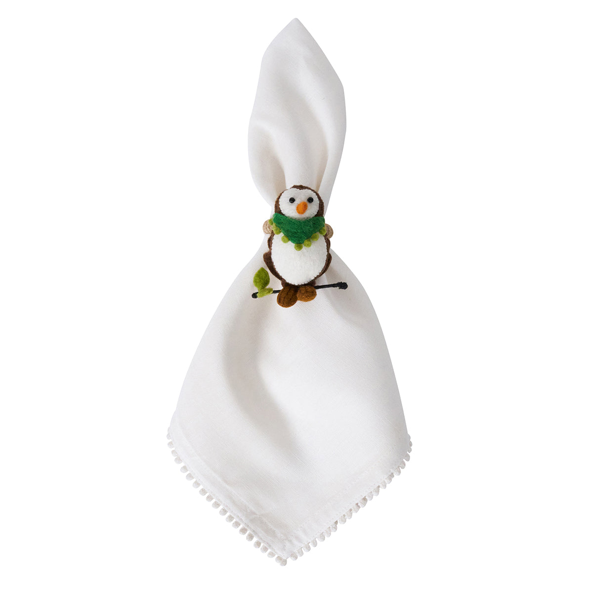 White napkin in a felt owl napkin ring