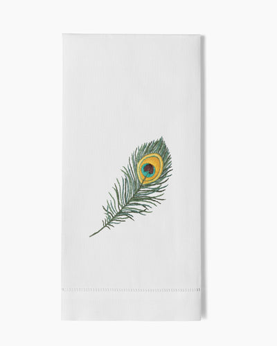 Henry Handwork white linen hand towel with embroidered peacock feather in green and gold.