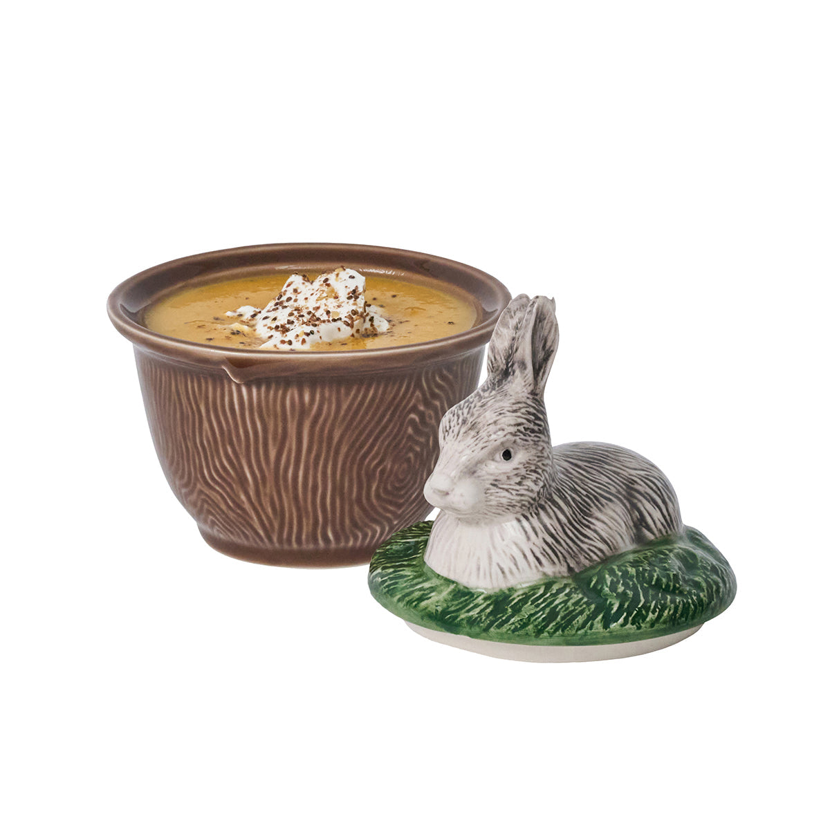 Juliska Forest Walk rabbit lidded bowl filled with soup, the rabbit lid set beside the bowl