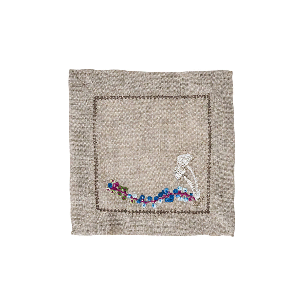 Juliska Forest Walk linen cocktail napkin embroidered with white mushrooms and purple and blue berries