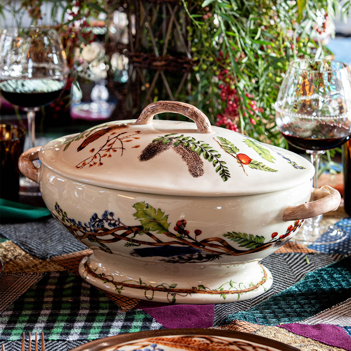 Forest Walk lidded tureen on a table with a patterned cloth and wine glasses
