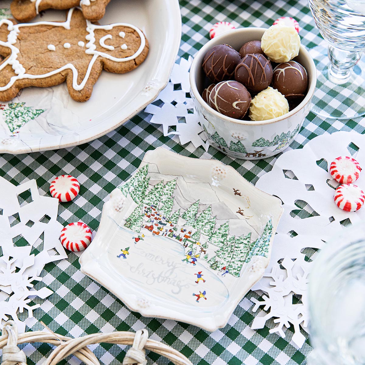 North Pole trinket tray beside gingerbread cookies and a bowl of chocolates