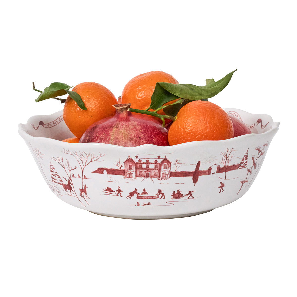 Ruby Winter Frolic serving bowl filled with oranges and pomegranates