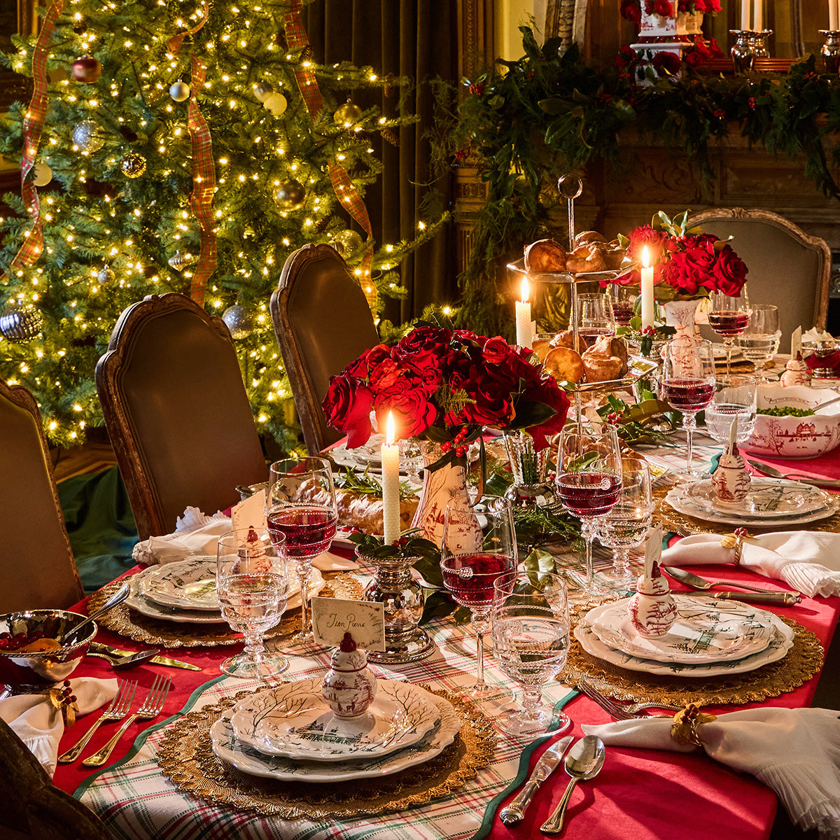 Candlelit Christmas dinner table with Winter Frolic dinnerware and place cards
