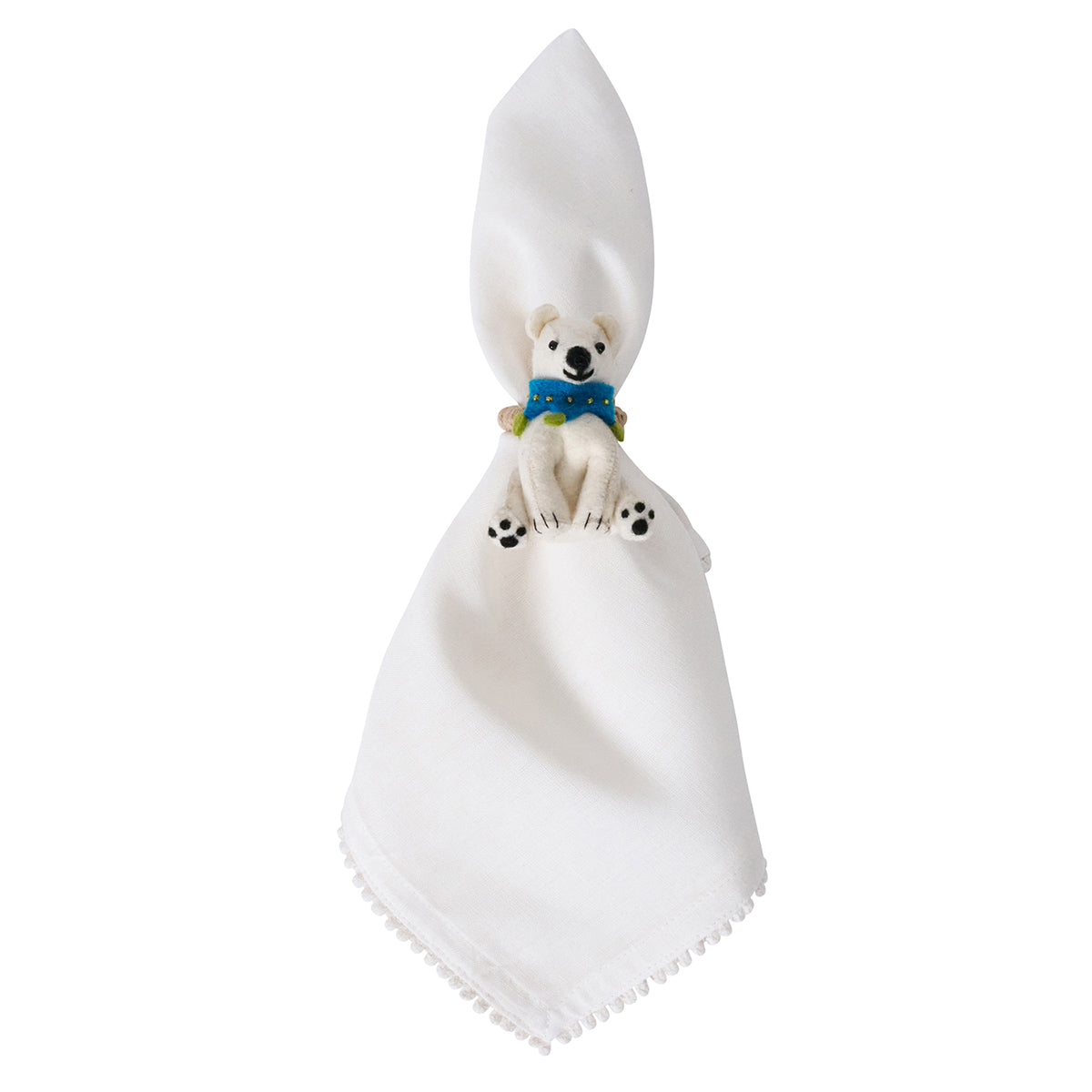 White napkin in a felt polar bear napkin ring