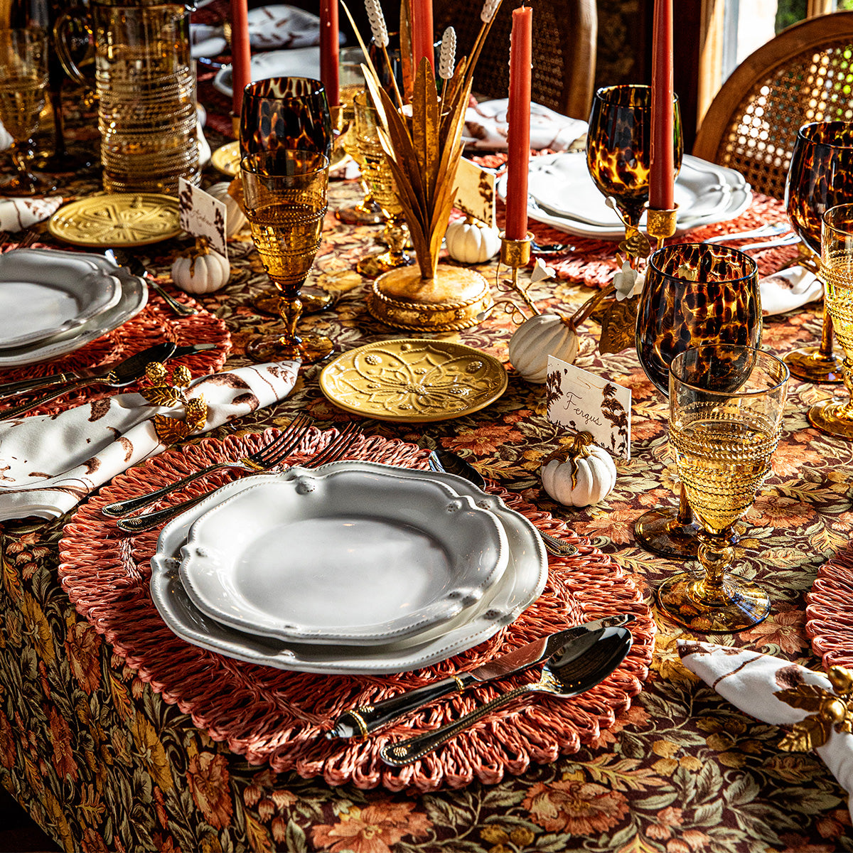 Autumn table set with pewter plates, candles and a white and gold Forest Walk pumpkin place card holder
