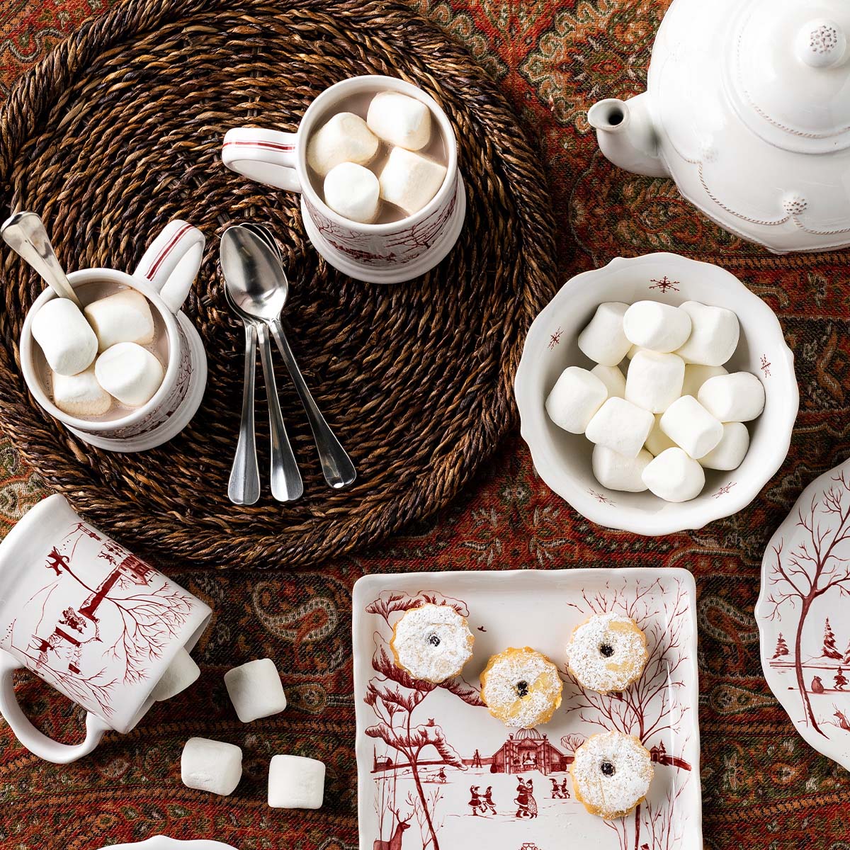 Ruby Winter Frolic mugs and a bowl of marshmallows on a woven charger