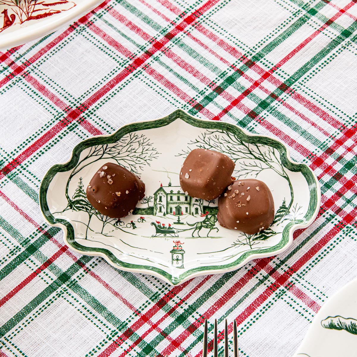 Evergreen Winter Frolic small tray of chocolate truffles on a plaid tablecloth