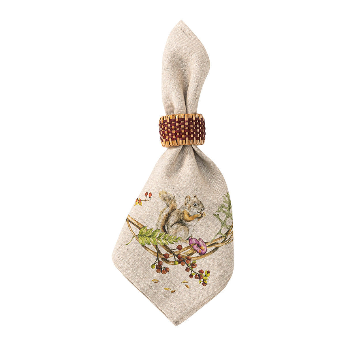 Juliska Forest Walk linen napkin folded through a beaded napkin ring