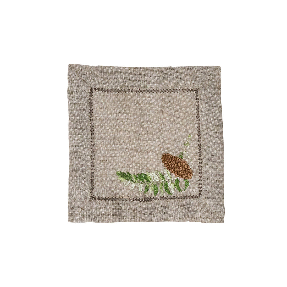 Juliska Forest Walk linen cocktail napkin with hemstitch border, embroidered with a fern and pinecone