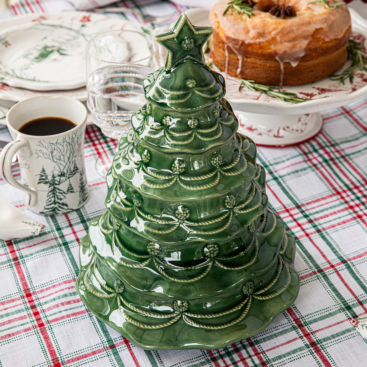 Basil Christmas tree cookie jar on a plaid tablecloth with a cake and mugs