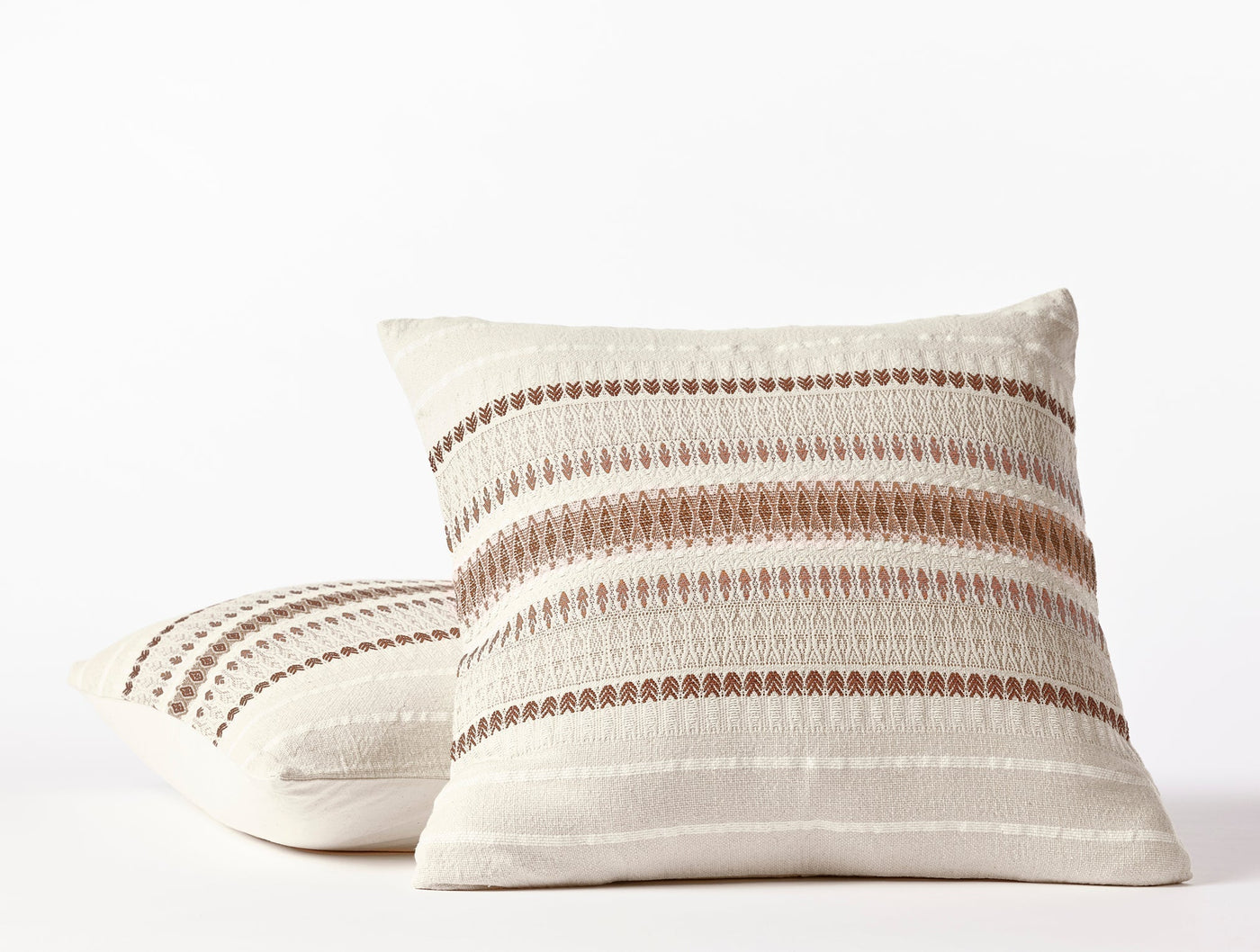 Coyuchi Lost Coast pillow pair, ivory with terracotta stripe embroidery detail.