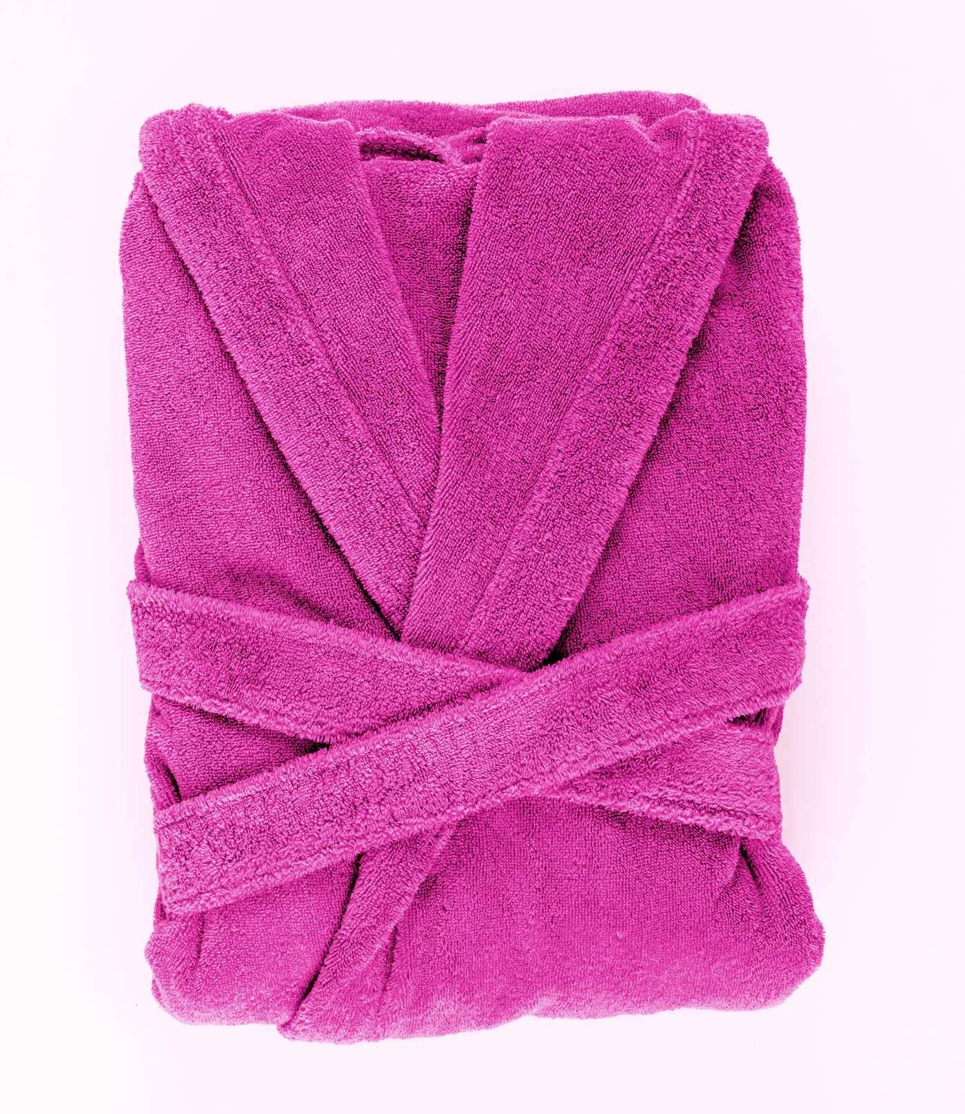 Fuchsia terry cotton robe folded flat, showing shawl collar and crossed belt.