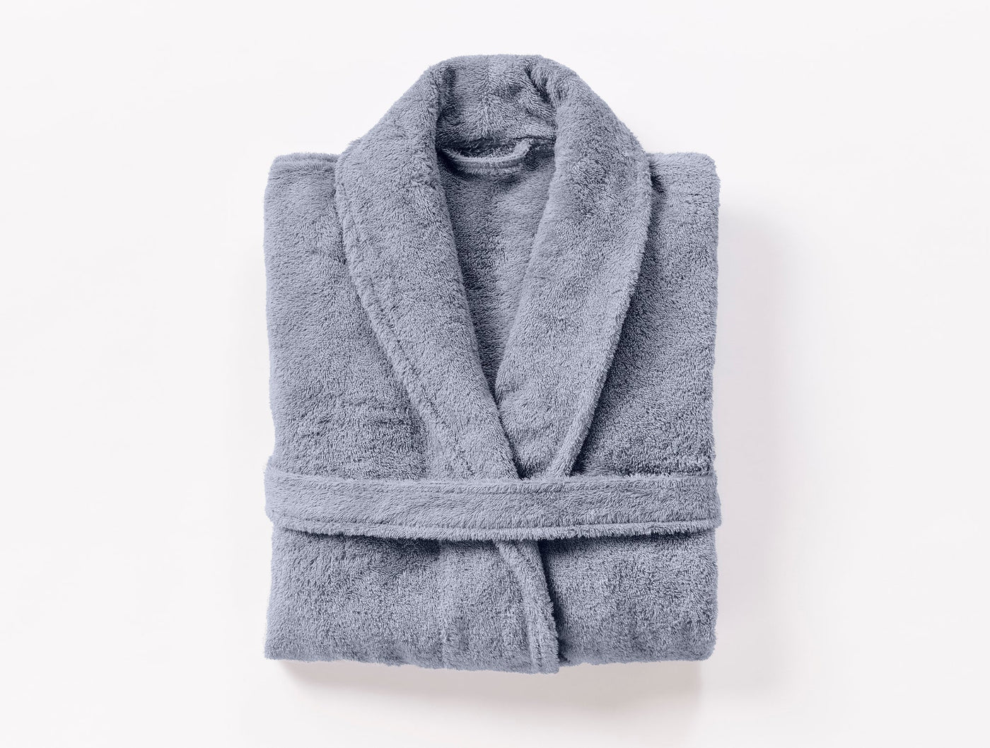 Coyuchi Cloud Loom robe folded flat, slate blue terry cloth, overhead view.
