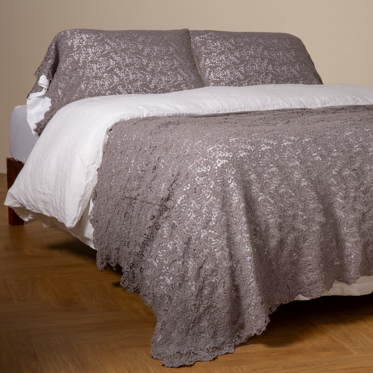 Bella Notte Allora bed scarf in French Lavender draped over foot of bed with matching shams.