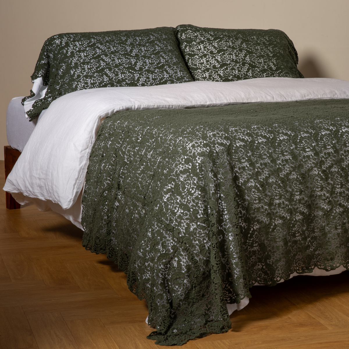 Juniper Allora bed scarf draped across a made bed with matching shams, lace texture detail.