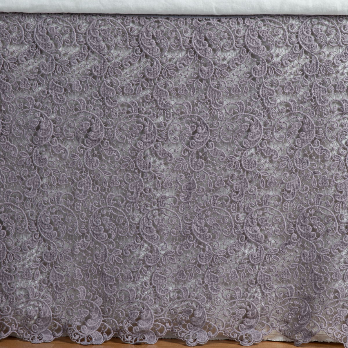 Bella Notte Allora bed skirt in French Lavender, showing full drop with scrolling lace embroidery.