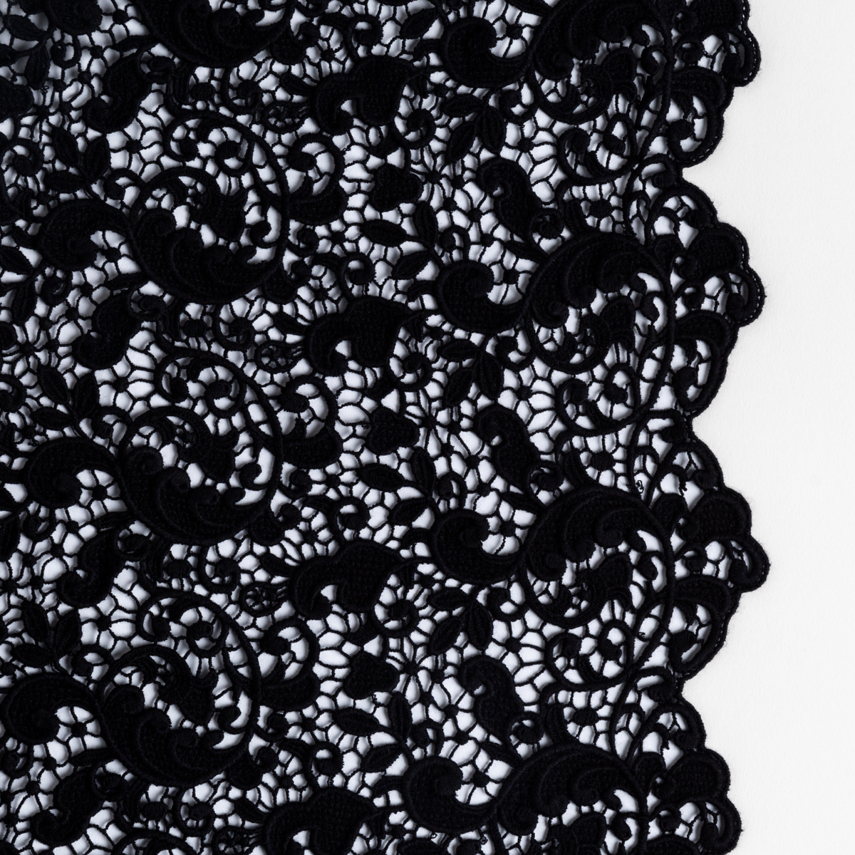 Close-up of Bella Notte Allora bed scarf in Corvino, intricate black floral lace trim detail.