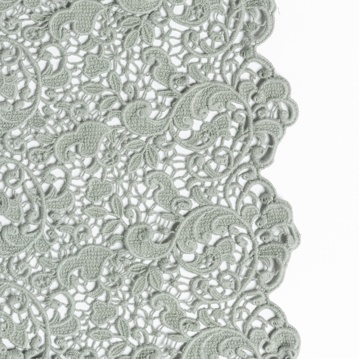 Close-up of Bella Notte Allora bed skirt in Eucalyptus, showing intricate floral lace trim detail.