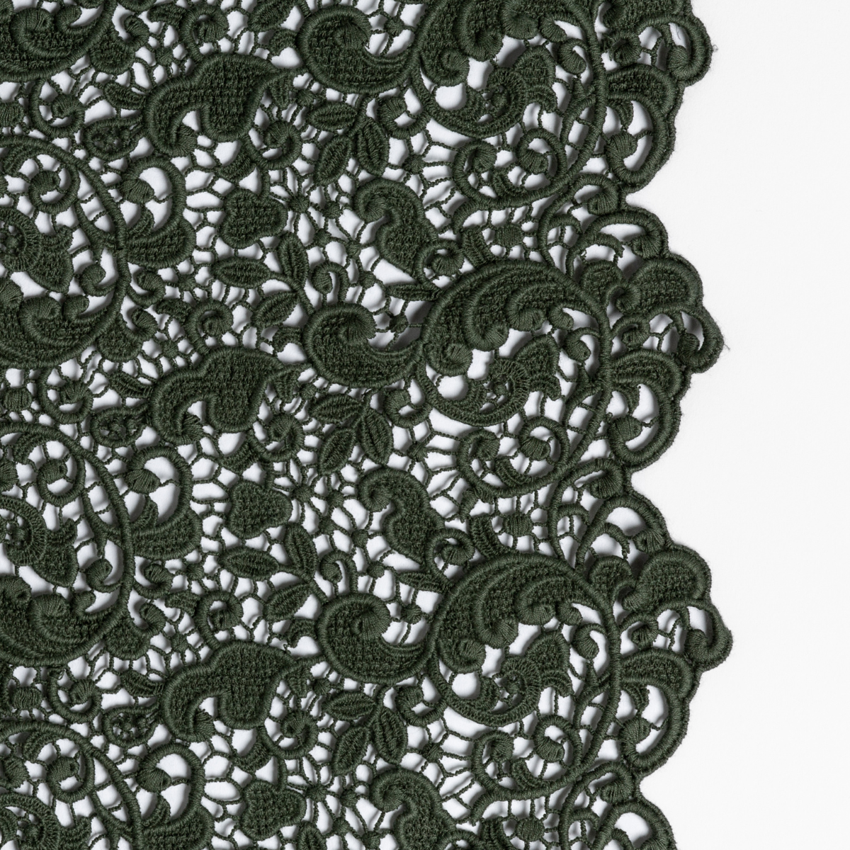 Close-up of Juniper Allora lace trim detail showing intricate floral and scroll cutwork pattern.